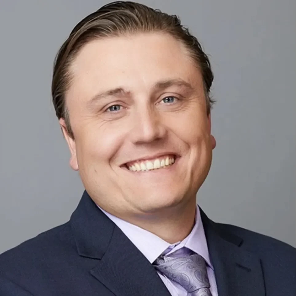 Man with brown hair smiling